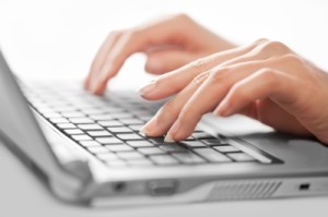 hands typing on laptop ID-10064916 by Nutdanai Apikhomboonwaroot